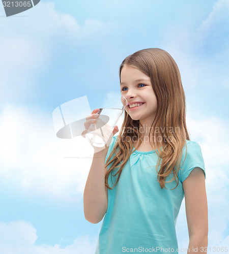 Image of smiling little girl with glass of water