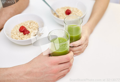 Image of close up of couple having breakfast at home