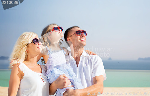 Image of happy family  over summer beach background