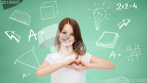 Image of smiling little girl in white blank t-shirt