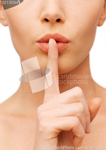 Image of woman making a hush gesture