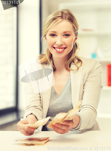 Image of businesswoman with euro cash money