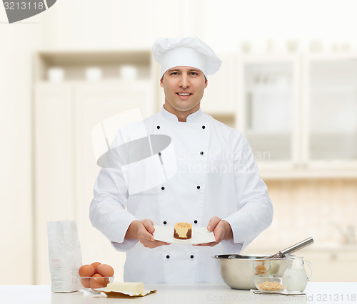 Image of happy male chef cook baking