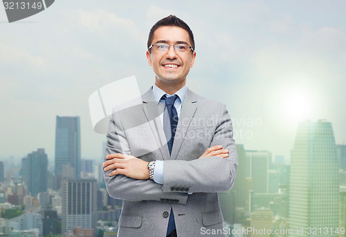 Image of happy smiling businessman in eyeglasses and suit