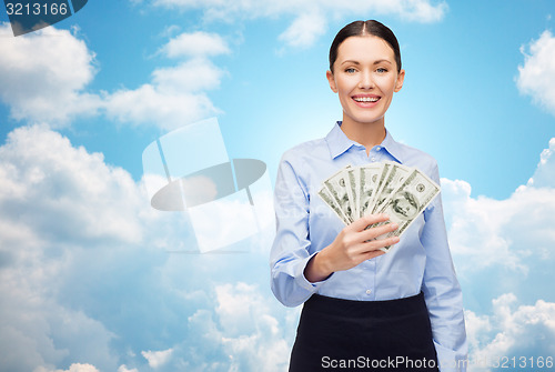 Image of businesswoman with dollar cash money