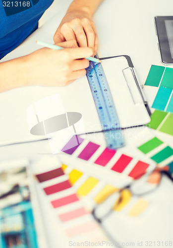 Image of woman working with color samples for selection