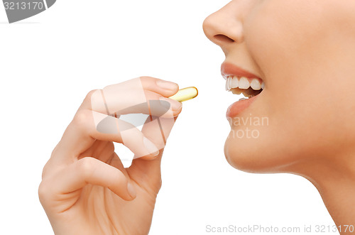 Image of beautiful woman with omega 3 vitamins