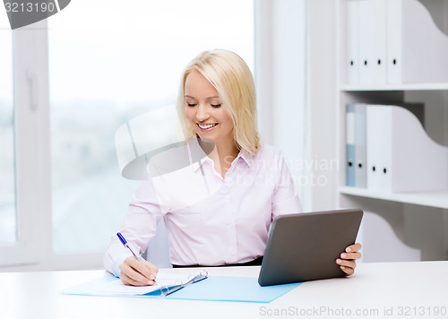 Image of smiling businesswoman or student with tablet pc