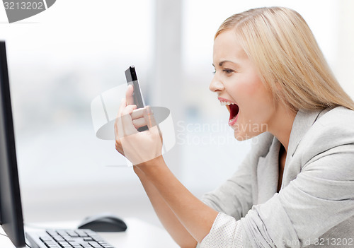 Image of angry woman with phone