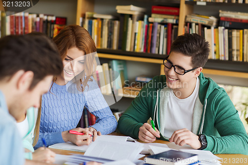 Image of students preparing to exam and writing in library