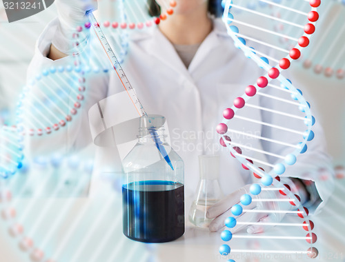 Image of close up of scientist making test in lab