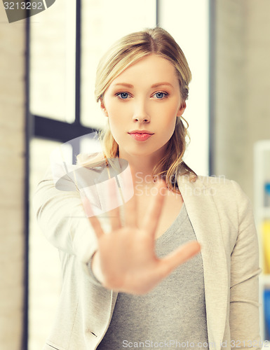 Image of woman making stop gesture