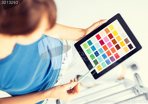 Image of woman working with color samples