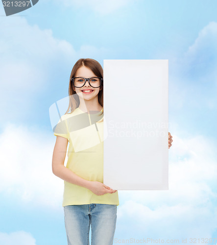 Image of little girl wearing eyeglasses with blank board