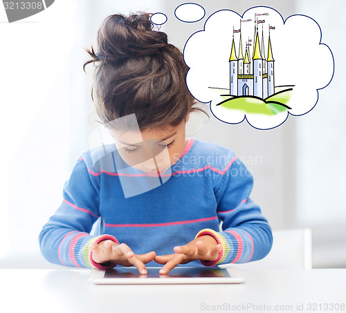 Image of little girl with tablet pc at home