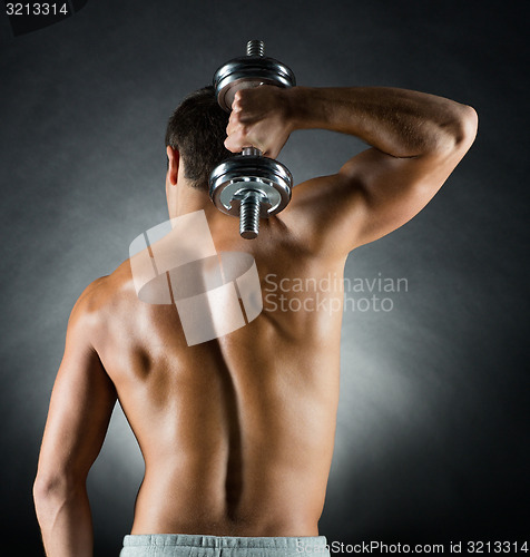 Image of young man with dumbbell