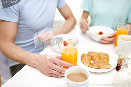 Image of close up of couple having breakfast at home