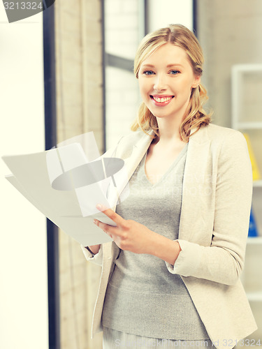 Image of happy woman with documents