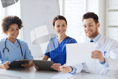 Image of group of happy doctors meeting at hospital office