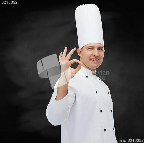 Image of happy male chef cook showing ok sign