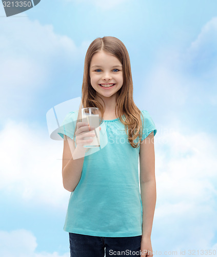 Image of smiling little girl with glass of milk