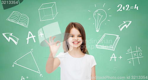 Image of smiling little girl in white blank t-shirt