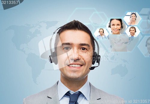 Image of smiling businessman in headset