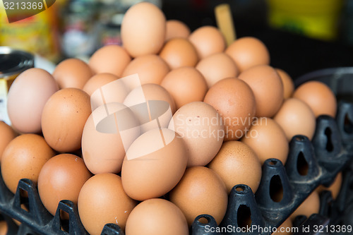 Image of fresh eggs on tray at asian street market