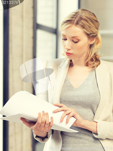 Image of calm woman with documents