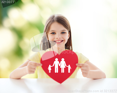 Image of beautiful little girl sitting at table