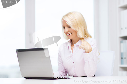 Image of smiling businesswoman or student with laptop