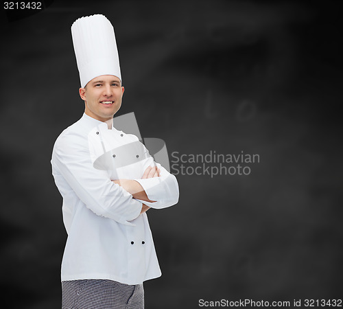 Image of happy male chef cook with crossed hands