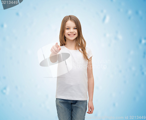 Image of little girl in blank white t-shirt pointing at you