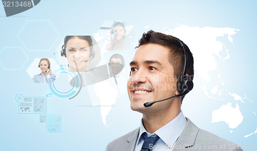 Image of smiling businessman in headset