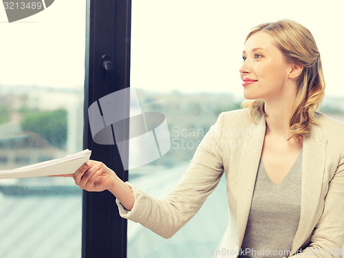 Image of happy woman with documents