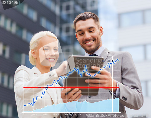 Image of smiling businessmen with tablet pc outdoors