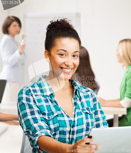 Image of student girl with tablet pc at school