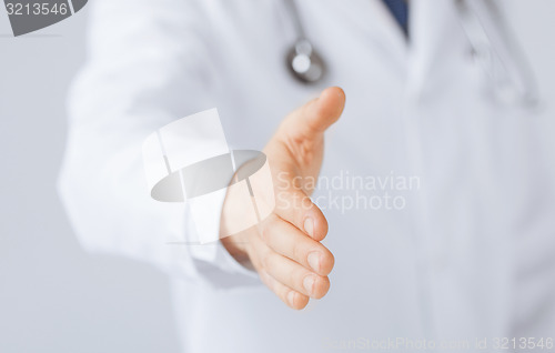 Image of male doctor with open hand ready for hugging