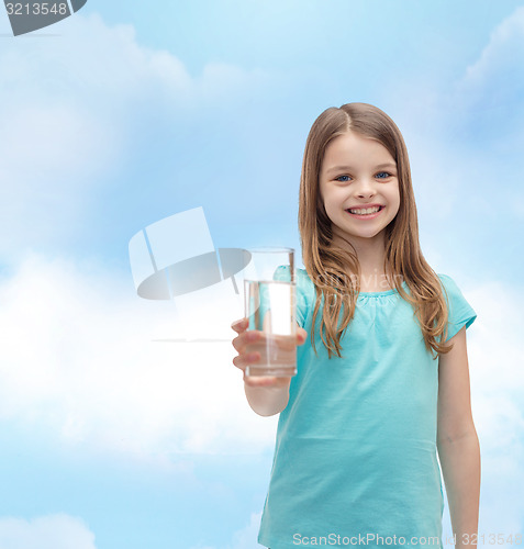 Image of smiling little girl giving glass of water