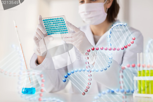 Image of close up of scientist making test in lab