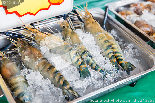 Image of shrimps or seafood on ice at asian street market