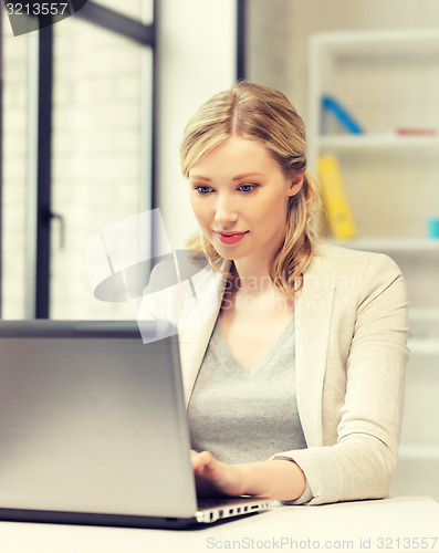 Image of happy woman with laptop computer