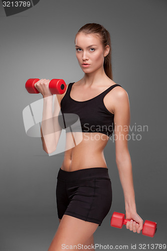 Image of Sporty woman doing aerobic exercise 