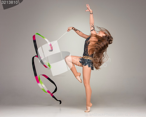 Image of teenager doing gymnastics dance with ribbon