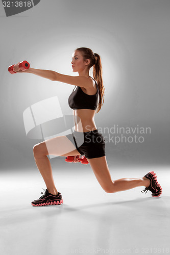 Image of Sporty woman doing aerobic exercise 