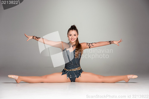 Image of portrait of a gymnast stretching twine