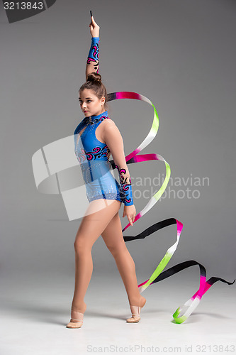 Image of teenager doing gymnastics dance with ribbon