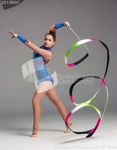Image of teenager doing gymnastics dance with ribbon
