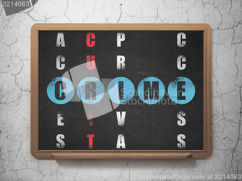 Image of Security concept: word Crime in solving Crossword Puzzle