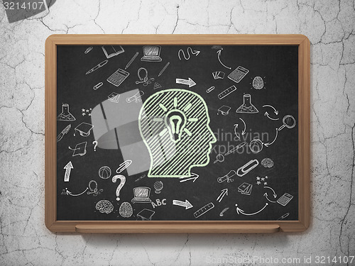 Image of Education concept: Head With Light Bulb on School Board background